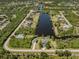 Aerial view of the waterfront community showcasing surrounding landscaping and canals at 13314 Prentice Ave, Port Charlotte, FL 33953