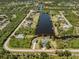 Aerial view of the waterfront community showcasing surrounding landscaping and canals at 13314 Prentice Ave, Port Charlotte, FL 33953