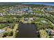Aerial view of the waterfront community showcasing surrounding landscaping and canals at 13314 Prentice Ave, Port Charlotte, FL 33953