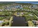 Aerial view of the waterfront community showcasing surrounding landscaping and canals at 13314 Prentice Ave, Port Charlotte, FL 33953