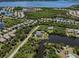 Expansive aerial view of a coastal community with waterfront homes and lush greenery at 13314 Prentice Ave, Port Charlotte, FL 33953