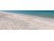 Wide angle view of a beach with an abundance of shells covering the sand at 13314 Prentice Ave, Port Charlotte, FL 33953