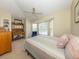 Cozy bedroom featuring a sitting area in front of bay windows and neutral decor at 13314 Prentice Ave, Port Charlotte, FL 33953
