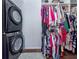 Organized closet with stacked washer and dryer units in a convenient location at 13314 Prentice Ave, Port Charlotte, FL 33953