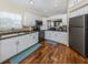 Bright and updated kitchen with stainless steel appliances and white cabinetry at 13314 Prentice Ave, Port Charlotte, FL 33953