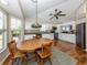 Kitchen nook with a four-chair table near bright windows and white kitchen cabinetry at 13314 Prentice Ave, Port Charlotte, FL 33953