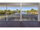 Screened lanai featuring views of the canal, private dock, and landscaped backyard at 13314 Prentice Ave, Port Charlotte, FL 33953