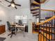 Bright home office with a spiral staircase, desk, filing cabinets, and view to the outside at 13314 Prentice Ave, Port Charlotte, FL 33953