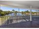 Large screened porch overlooking a waterfront view, the boat lift, and the large pool at 13314 Prentice Ave, Port Charlotte, FL 33953