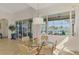 Light and airy dining room with view to the lanai and pond at 138 Rimini Way, North Venice, FL 34275