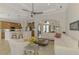 Bright and open living room connected to kitchen and dining area, great for entertaining at 138 Rimini Way, North Venice, FL 34275