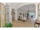 Bright and spacious living room with tiled floors, archways, and a seamless transition to the lanai at 138 Rimini Way, North Venice, FL 34275