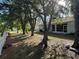 Enjoy the spacious backyard with mature trees providing plenty of shade at 1483 Prairie Ter, North Port, FL 34286