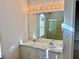 Bright bathroom with double sinks, spacious vanity, and well-lit mirror for a functional design at 1483 Prairie Ter, North Port, FL 34286