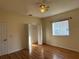 Bright bedroom featuring wood-look floors, a ceiling fan, and a closet at 1483 Prairie Ter, North Port, FL 34286