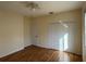 A bedroom featuring wood-look floors, a ceiling fan, and a closet at 1483 Prairie Ter, North Port, FL 34286