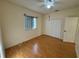 A bedroom featuring wood-look floors, a ceiling fan, and a closet at 1483 Prairie Ter, North Port, FL 34286