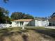 Charming single-story home with a well-maintained front yard and attached two car garage at 1483 Prairie Ter, North Port, FL 34286