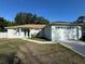 Charming single-story home featuring a two-car garage, manicured lawn, and beautiful curb appeal at 1483 Prairie Ter, North Port, FL 34286