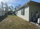 Side view of home featuring hurricane shutters and utilities at 1483 Prairie Ter, North Port, FL 34286