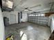 Spacious two car garage with overhead lighting and room for storage at 1483 Prairie Ter, North Port, FL 34286
