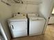 Laundry room with side-by-side washer and dryer at 1483 Prairie Ter, North Port, FL 34286