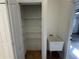 Pantry with wire shelving and utility sink at 1483 Prairie Ter, North Port, FL 34286
