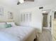 Inviting bedroom with neutral décor, ceiling fan, and ensuite bathroom at 1730 Manasota Beach Rd # 212, Englewood, FL 34223