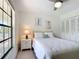 Comfortable bedroom with a view to the outside and ample natural light at 1730 Manasota Beach Rd # 212, Englewood, FL 34223