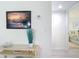 Hallway featuring a decorative table and view into the bedroom at 1730 Manasota Beach Rd # 212, Englewood, FL 34223