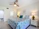 Tranquil main bedroom with an ensuite bathroom and coastal themed decor at 1730 Manasota Beach Rd # 212, Englewood, FL 34223
