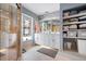 Well-lit bathroom with a double vanity, walk in shower, and ample storage at 1833 Raintree Ln, Venice, FL 34293
