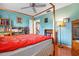 Bedroom with hardwood floors and natural light from large window at 1833 Raintree Ln, Venice, FL 34293