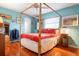 Bedroom with hardwood floors, natural light, and ample closet space at 1833 Raintree Ln, Venice, FL 34293