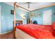 Bedroom with hardwood floors and minimalist furnishings at 1833 Raintree Ln, Venice, FL 34293