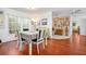 Spacious dining room featuring a table for four and ample natural light at 1833 Raintree Ln, Venice, FL 34293