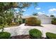 Well maintained single story home with mature landscaping, and a large driveway to the attached two car garage at 1833 Raintree Ln, Venice, FL 34293