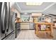 Functional kitchen offering stainless steel appliances and a central island at 1833 Raintree Ln, Venice, FL 34293