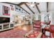 Open concept living room with kitchen view, dining room and views to the screened lanai at 1833 Raintree Ln, Venice, FL 34293
