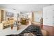 Bright living room showcasing a cozy seating area and an open floor plan at 1833 Raintree Ln, Venice, FL 34293