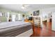 Spacious main bedroom featuring wood floors and neutral wall color at 1833 Raintree Ln, Venice, FL 34293
