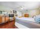 Open main bedroom with hardwood floors and ensuite bathroom at 1833 Raintree Ln, Venice, FL 34293