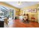 Office space with wood floors, a sliding door, and natural light at 1833 Raintree Ln, Venice, FL 34293