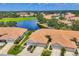 Gorgeous aerial view of the homes next to the lake in a well-kept neighborhood at 1892 San Silvestro Dr, Venice, FL 34285