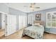 Comfortable bedroom with shutters, and french doors at 1892 San Silvestro Dr, Venice, FL 34285