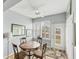 Sunlit breakfast nook with a table, chairs, and outdoor access at 1892 San Silvestro Dr, Venice, FL 34285