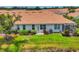 Lovely exterior view showcasing the property's well-maintained lawn, landscaping, and screened-in patio at 1892 San Silvestro Dr, Venice, FL 34285