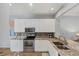 Kitchen featuring granite countertops, stainless steel appliances and white cabinetry at 1892 San Silvestro Dr, Venice, FL 34285