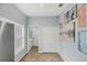 Bright kitchen featuring stainless steel refrigerator, tile floors, and artwork on the walls at 1892 San Silvestro Dr, Venice, FL 34285
