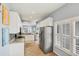 Eat-in kitchen featuring granite counters, stainless appliances and tile flooring at 1892 San Silvestro Dr, Venice, FL 34285